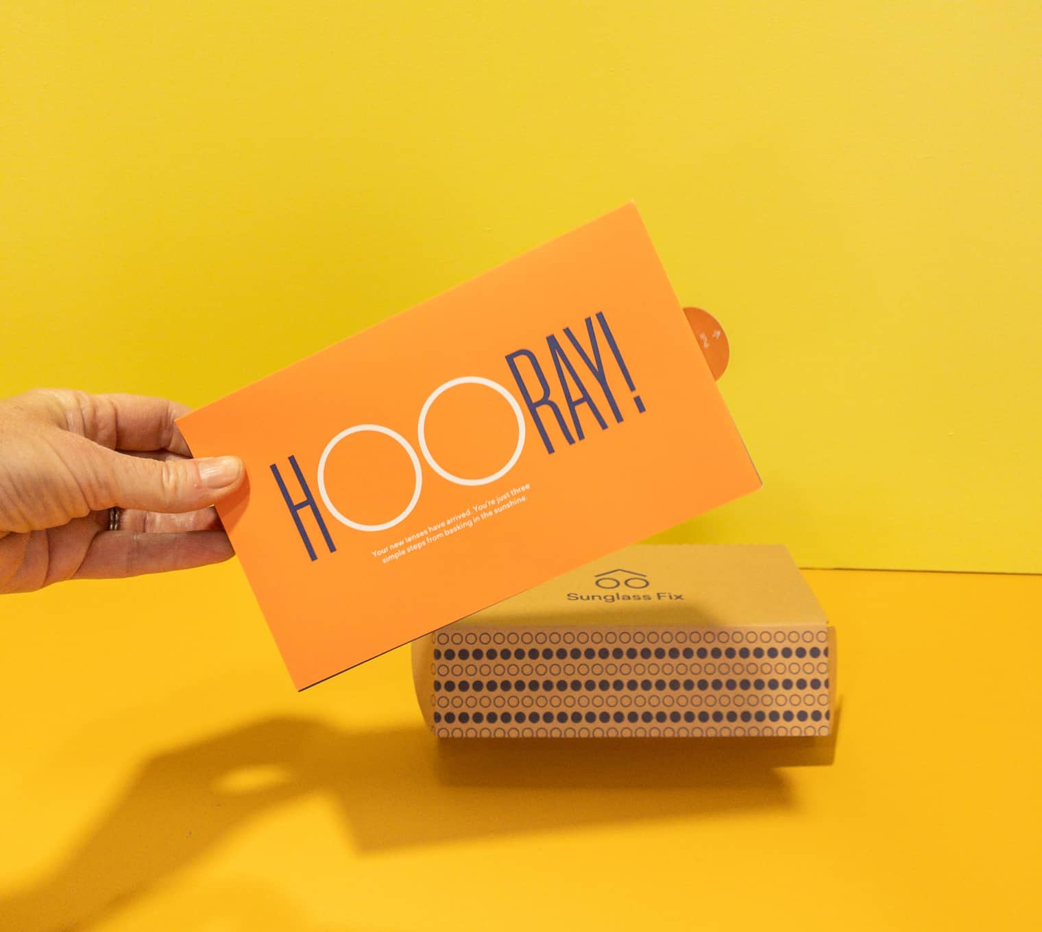 Sunglass Fix packaging with a branded box for sunglasses in background